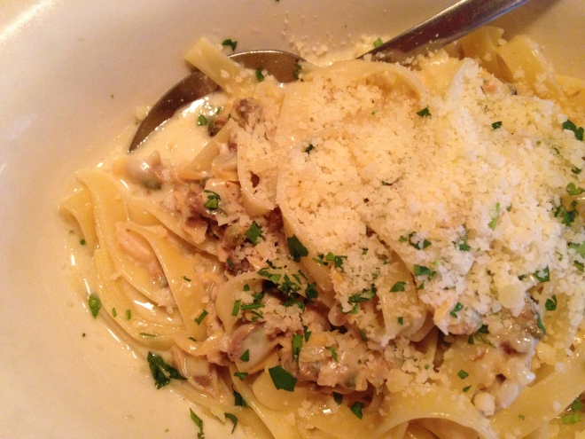 fettuccine with white clam sauce and cheese on top