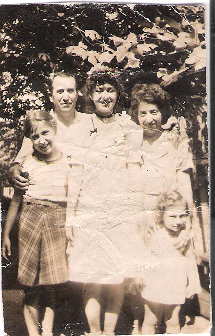 My mom in center, with her parents, my aunt lily at left, and we can't remember who the baby is