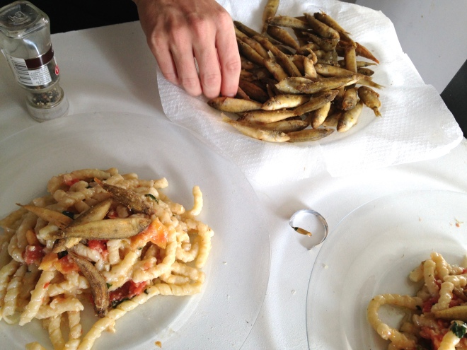 tiny fried fish with pasta and almond pesto